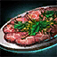 Plate of Beef Carpaccio with Mint Garnish